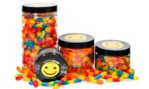 gummy worms in four jars